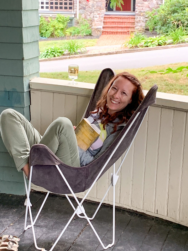 Jenn sitting on a deck chair